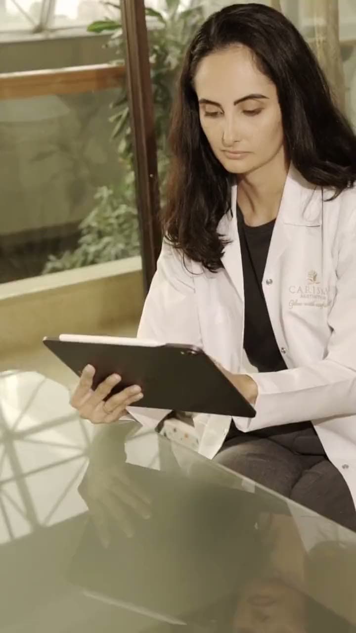 A doctor reviewing a treatment plan on a tablet